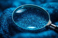 Magnifying glass examining digital binary code and data network, representing cybersecurity analysis, data investigation, and technology research for business and IT concepts.