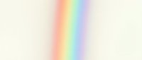 Soft blurred rainbow gradient with pastel colors transitioning smoothly from red to violet on light background for creative design projects.