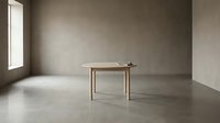 Minimalist wooden table in empty concrete room with natural light from window, modern interior design space.