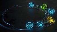 Futuristic holographic circular interface with glowing business icons on dark background for technology presentations and digital marketing materials.