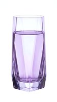 Transparent purple glass filled with lavender liquid, isolated on white background. Perfect for beverage, drink, and glassware design projects.