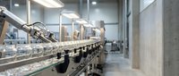 Automated production line with robotic arm in modern industrial facility. Manufacturing automation technology for efficient processing and assembly operations.
