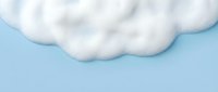 Fluffy white cotton clouds floating against soft blue sky background for weather forecast, meteorology presentations and atmospheric design projects.