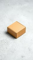 Closed kraft cardboard box on concrete surface, suitable for shipping, packaging, delivery, and logistics design projects.