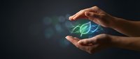 Hands protecting glowing green leaf symbol representing environmental conservation, sustainability and eco-friendly business practices on dark background.