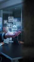 Businessman hand presenting holographic digital icons for analytics, user management and cloud integration in modern office environment.
