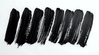 Black watercolor brush strokes collection showing different opacity and texture levels on white background, isolated design element for creative projects.