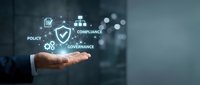 Business professional hand presenting digital compliance governance policy icons with shield symbol representing corporate risk management and regulatory framework.