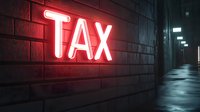 Glowing red neon tax sign on brick wall in dark moody corridor creates dramatic atmosphere for financial and business concepts.