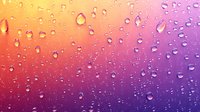 Water drops on glass surface with vibrant orange to purple gradient background creating atmospheric mood and abstract pattern for modern design projects.