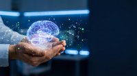 Businessman hands holding glowing digital brain hologram with neural network connections representing artificial intelligence and machine learning technology.