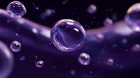 Transparent water drops floating in purple space with bokeh effect and light reflections create dreamy atmospheric composition for backgrounds and wallpapers.