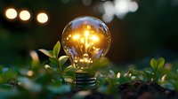 Glowing light bulb surrounded by green leaves symbolizing eco-friendly energy, innovation and sustainable technology solutions for environmental concepts.