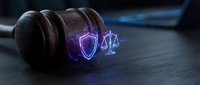 Wooden gavel with glowing neon shield and scales symbols representing legal protection, justice system, and cybersecurity law compliance for corporate governance.
