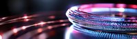 Futuristic circular light ring with vibrant pink and blue neon glow against dark background, creating dynamic technological atmosphere.