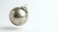 Silver metallic Christmas ornament ball with vintage distressed finish isolated on white background for holiday decorations and festive design projects.