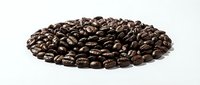 Roasted coffee beans isolated on white background, ready for beverage production, café design, and packaging applications.