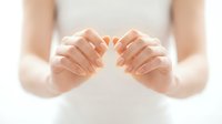 Hands cupping glowing light symbolizing protection, care, healing energy and spiritual wellness concepts for healthcare and meditation designs.