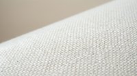 Closeup of natural linen fabric with woven texture, suitable for interior design, textile backgrounds, and home decor projects.