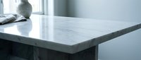 Modern white marble kitchen countertop with natural veining in bright interior space for home design and renovation projects.