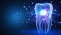 Glowing translucent tooth with energy rays on dark blue cosmic background with particles. Digital dental care concept for medical presentations and healthcare designs.