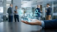 Professional businessman presenting digital legal compliance icons including shield, contract document and gavel in modern office environment.