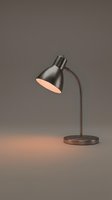 Modern desk lamp with brushed metal finish and adjustable arm, emitting warm light. Suitable for office, home workspace, and interior design projects.