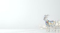 Isolated goat standing in profile on white background with watercolor paint splashes and bokeh light effects, ready for design projects, clipart, and merchandise applications.