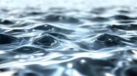 Smooth rippling water surface with gentle waves creating a serene blue-toned pattern of light and shadow, ideal for environmental or wellness themes.