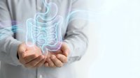 Healthcare professional displaying holographic digestive system model for medical education and gastroenterology consultation purposes.