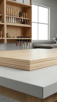 Stack of plywood sheets on workbench in modern woodworking workshop with organized tool storage and natural lighting for carpentry projects.