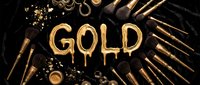 Luxury gold text with ammunition, bullets, and metallic objects arranged on dark background for wealth and power concepts.
