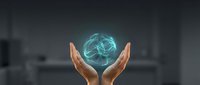Hands protecting glowing blue brain with neural network connections representing artificial intelligence, machine learning and cognitive technology innovation.