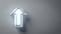 Glowing neon arrow pointing upward on gray wall, symbolizing growth, progress, and success for business and marketing designs.