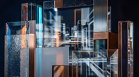 Abstract geometric composition with metallic cubes and glass elements creating modern digital art background for technology and innovation concepts.