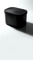 Black plastic food storage container with lid isolated on white background for kitchen organization and meal prep design projects.