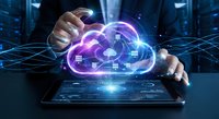 Businessman hands protecting glowing purple cloud computing network above digital tablet with futuristic interface and data connections.