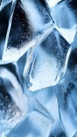 Macro shot of crystal clear ice cubes with blue tones and natural light reflections showing frozen texture and patterns for beverage and cooling concepts.