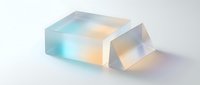 Translucent glass blocks with iridescent rainbow gradient colors creating prismatic light effects on white background for modern design projects.