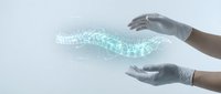 Hands in protective gloves holding glowing digital data stream with binary code particles floating between palms representing cybersecurity and data protection.