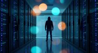 Silhouette of person standing in modern data center server room with glowing blue lights and bokeh effects creating futuristic technology atmosphere.