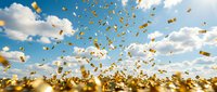 Golden confetti falling from blue sky with white clouds creating festive celebration atmosphere for party events and special occasions.