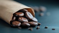Dark paper cone on blue textured surface, selective focus creates appetizing mood for food photography.