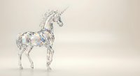 Crystal clear glass unicorn figurine with rainbow reflections on neutral background for home decor and fantasy collections.