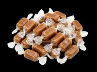 Pile of wrapped caramel candies isolated on transparent background, ready for confectionery clipart, stickers, t-shirt design, and print on demand use.