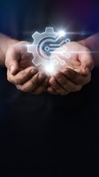 Hands holding glowing gear and circuit board icon with light rays, representing technology innovation, engineering solutions, and digital transformation for business applications.