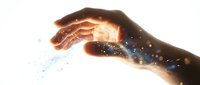 Close-up of hand releasing glowing particles and magical light energy, symbolizing power, creation, and transformation for spiritual or technology concepts.