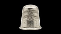 Silver metal thimble with textured top isolated on transparent background, ready for sewing clipart, craft stickers, print on demand, and T-shirt design use.