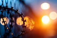 Metal chain with bokeh lights at sunset, symbolizing security, connection, and strength for business, technology, and industrial design projects.