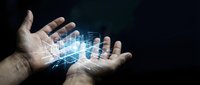 Caucasian male hands holding glowing digital data visualization with blue holographic bar charts and network connections against dark background for business analytics and technology concepts.
